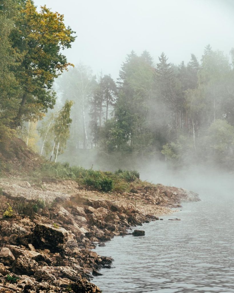 Fog sets in over the river Daugava, creating a picturesque combination of water, rocks and trees